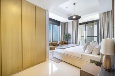 a bedroom with a bed and a large window at Modern 3-Bedroom Apartment with Breathtaking City Views in Dubai