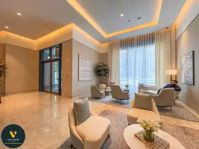 a large living room with couches and chairs at Vogue Downtown Act One near Burj Khalifa and Dubai Mall, Two Bedroom Apartment with Balcony and City Skyline View, Access to All Amenities in Dubai