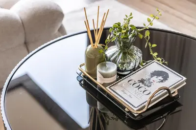 a table with a mirror and a tray with cosmetics at Serene 2BRplus1 Haven in Oakley JVC - 5star Amenities in Dubai