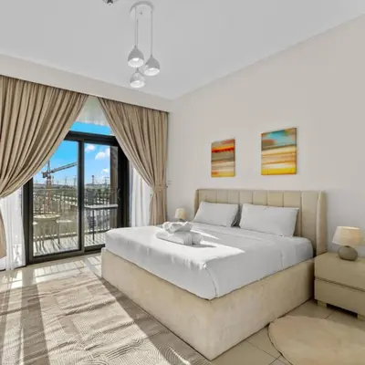 a bedroom with a large bed and a large window at 016 - Dubai Hills in Dubai