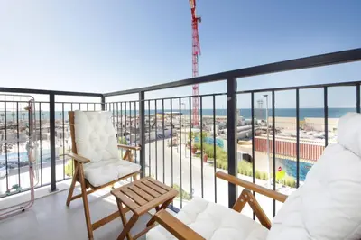 a balcony with a view of the ocean at 015 - Le Pont 1 in Dubai