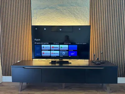 a black desk with a tv on top of it at Dubai Marina Escan Tower Family Apartment in Dubai