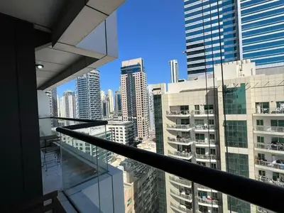 a view of a city from a balcony in a building at Dubai Marina Escan Tower Family Apartment in Dubai