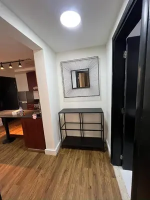 a living room with a mirror on the wall at Dubai Marina Escan Tower Family Apartment in Dubai