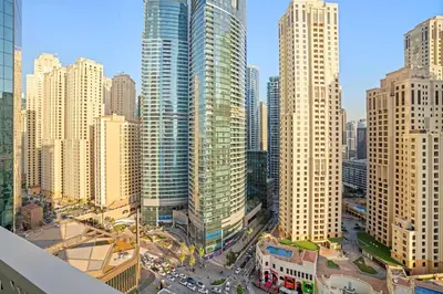 an aerial view of a city with tall buildings at Modern 1BR Apartment Steps from Beach and Dubai Nightlife in Dubai