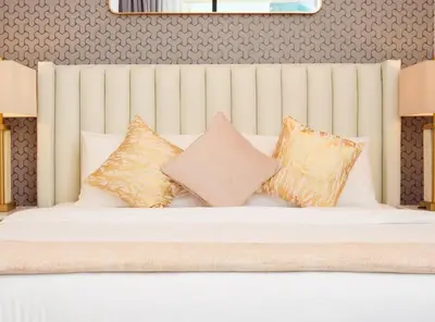 a white bed with pillows on top of it at Elite Royal Apartment - Panoramic Burj Khalifa View - Sky Edition - Luxurious - Zacharyas in Dubai