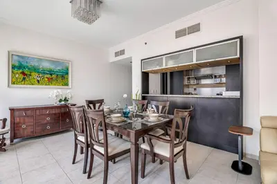 a dining room with a table and chairs at GuestReady - Contemporary haven in Dubai Marina in Dubai