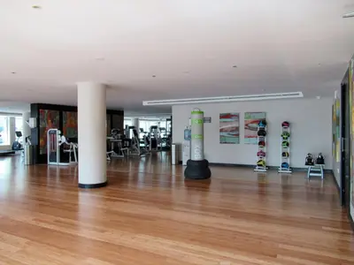 a room with wooden floors and skateboards on display at GuestReady - Contemporary haven in Dubai Marina in Dubai