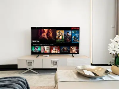 a living room with a flat screen tv on a wall at Huge Lux 1BHK in Prime Business Bay with Private Jacuzzi in Dubai