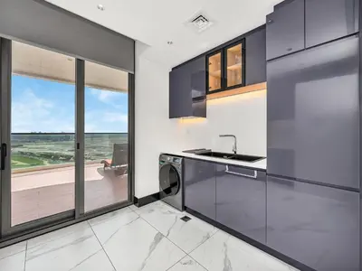 a kitchen with a sink and a dishwasher at Huge Lux 1BHK in Prime Business Bay with Private Jacuzzi in Dubai