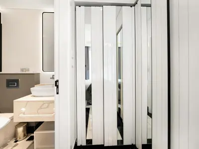 a bathroom with a mirror and a sink at Huge Lux 1BHK in Prime Business Bay with Private Jacuzzi in Dubai