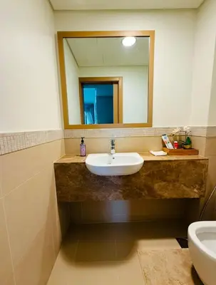 a bathroom with a sink and a mirror at Nivis find-Burj Vista-Direct access to Dubai mall in Dubai