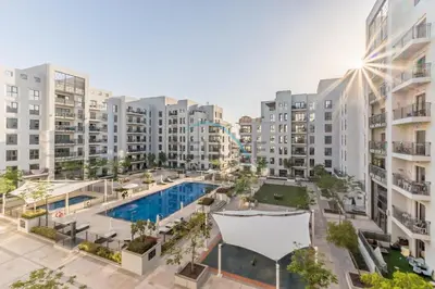 an aerial view of an apartment complex with a swimming pool at Balcony Overlooking the Swimming Pool, Just Minutes from the Park, Town Square Safi 1A, Al Yelayiss 2 by Deluxe Holiday Homes in Dubai