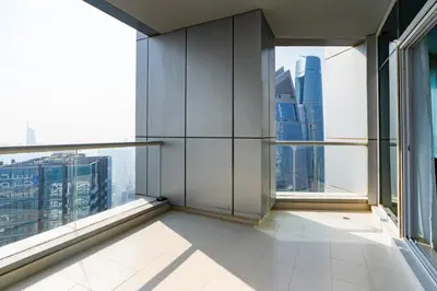 an empty room with windows in a skyscraper at Classy Upgraded High Floor Prime Location in Dubai