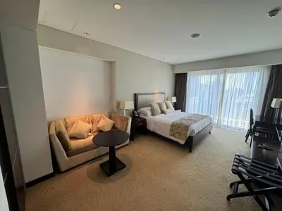 a hotel room with a bed and a couch at Stylish studio Located in JW Mariott Hotel Dubai Marina in Dubai