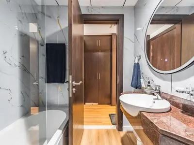 a bathroom with a sink and a mirror at Special Rate - Luxurious Studio - Golf View in Dubai