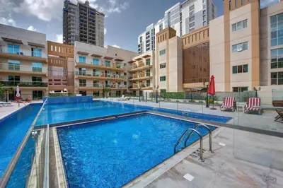 an image of a swimming pool at a apartment complex at Everything you need for a perfect Dubai Stay in Dubai