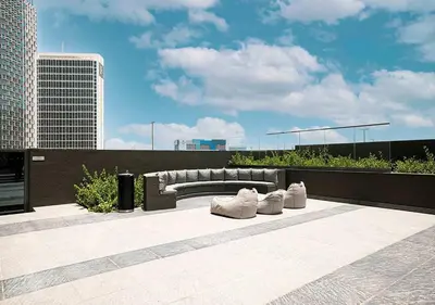 a bench sitting on top of a building at Chic Studio with Top Amenities in Dubai