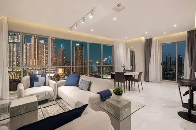 a living room with a view of a city at Downtown Sanctuary Iconic Burj Views & Luxury Living in Dubai