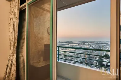 a shower door with a view of a city at Dubai Marina Sea View Sunset View Dubai Eye View in Dubai