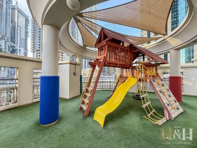 a play area with a slide in a building at Dubai Marina Sea View Sunset View Dubai Eye View in Dubai