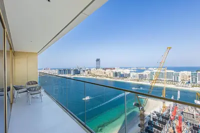 a balcony with a view of the ocean at Lux Designer 2BR - Grand Bleu - Waterfront Living in Dubai