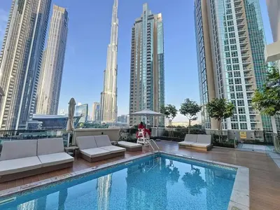 a swimming pool with a view of the city at Act One Act Two - Exquisite One Bed in Downtown in Dubai