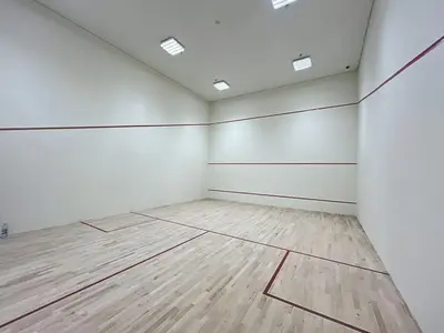 an empty room with white walls and wooden floors at Forte Tower - Aesthetic Three Bedroom in Downtown in Dubai