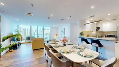 a dining room and kitchen with a table and chairs at Vacationer I Hidden Gem in Marina l 3 Bedroom I Yacht Views, Free Pool, Gym & Wi-Fi in Dubai