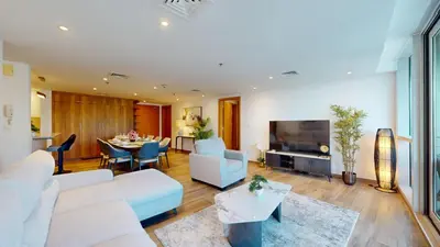 a living room with a couch and a table at Vacationer I Hidden Gem in Marina l 3 Bedroom I Yacht Views, Free Pool, Gym & Wi-Fi in Dubai