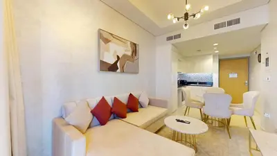 a living room with a couch and a table at Aykon Tower - Calm One Bed in Business Bay in Dubai