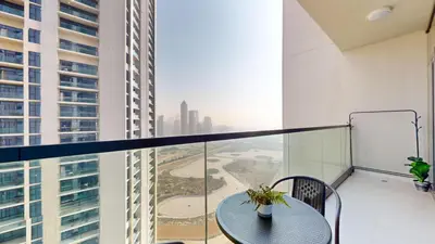 a balcony with a table and a view of a city at Aykon Tower - Calm One Bed in Business Bay in Dubai
