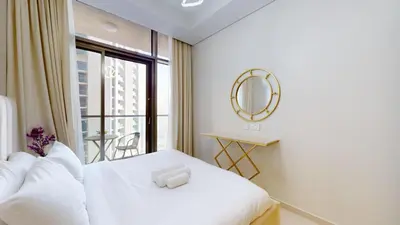 a bedroom with a white bed and a mirror at Aykon Tower - Calm One Bed in Business Bay in Dubai