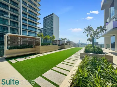 a garden on the roof of a building at Perfect Blend of Comfort and Cozy 1 Bedroom in JVC in Dubai