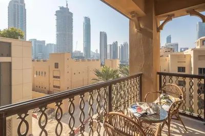 a balcony with a table and chairs and a city skyline at Frank Porter - Yansoon 5 in Dubai