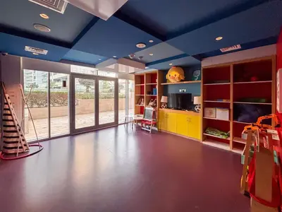 a living room with blue ceilings and a room with a guitar at Frank Porter - Damac Majestine in Dubai