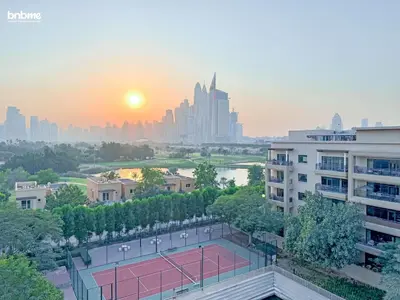 a tennis court with a city skyline in the background at bnbmehomes - Golf Tower 1 in Dubai