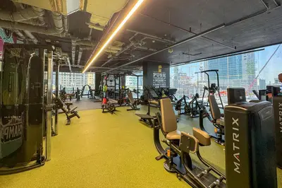 a gym with treadmills and cardio equipment in a building at Elegant 1-Bedroom with Stunning Lake View in JLT in Dubai