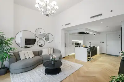 a living room with a couch and a table at 1 BR Exquisite Urban Living in Downtown Dubai in Dubai