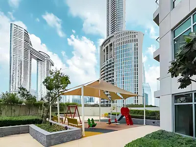 a playground in a city with tall buildings at 1 BR Exquisite Urban Living in Downtown Dubai in Dubai