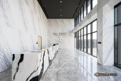 a lobby with a row of counters in a building at 1-bedroom Apartment In Binghatti Avenue in Dubai