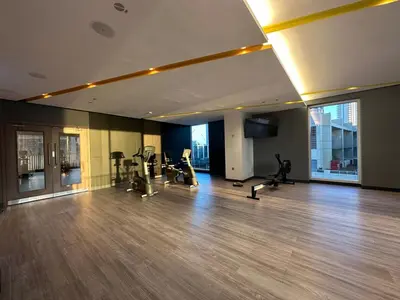 a gym with treadmills and exercise equipment in a building at Park View Stay at Creek Horizon in Dubai
