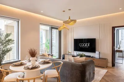 a living room with a couch and a table at The Boulevard Suite Luxury near Burj Khalifa in Dubai