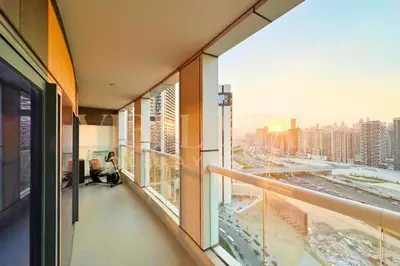 an office building hallway with a view of a city at Prime 1BR Location Minutes to Burj Dubai Mall by Vibel in Dubai