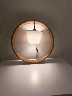 a round mirror with a lamp on a wall at Stylish Boutique Loft Duplex, Near Circle Mall, Balcony, Fast WiFi, 2 Pools and Gym in Dubai