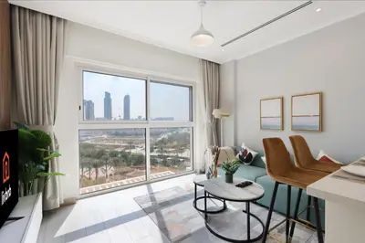 a living room with a large window at Livbnb-Modern Living 1B Apartment in JVC in Dubai