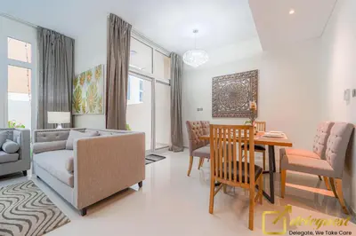 a living room with a couch and a table at Prestine 3BR Villa in DH2 by deleguest in Dubai