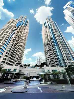 two tall white buildings in a city at Near Burj Khalifa, Dubai Fountain view, Dubai Mall in 10 mins walk in Dubai