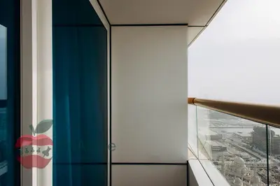 an apple logo on the side of a window in a building at Sea and Dubai Ain view Close to Private Beach in Dubai