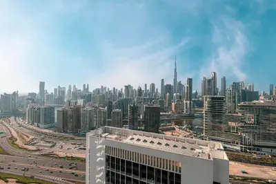 a view of a large city with a building at Modern 1-Bedroom Apartment with Stunning Burj Khalifa and city Views in Dubai